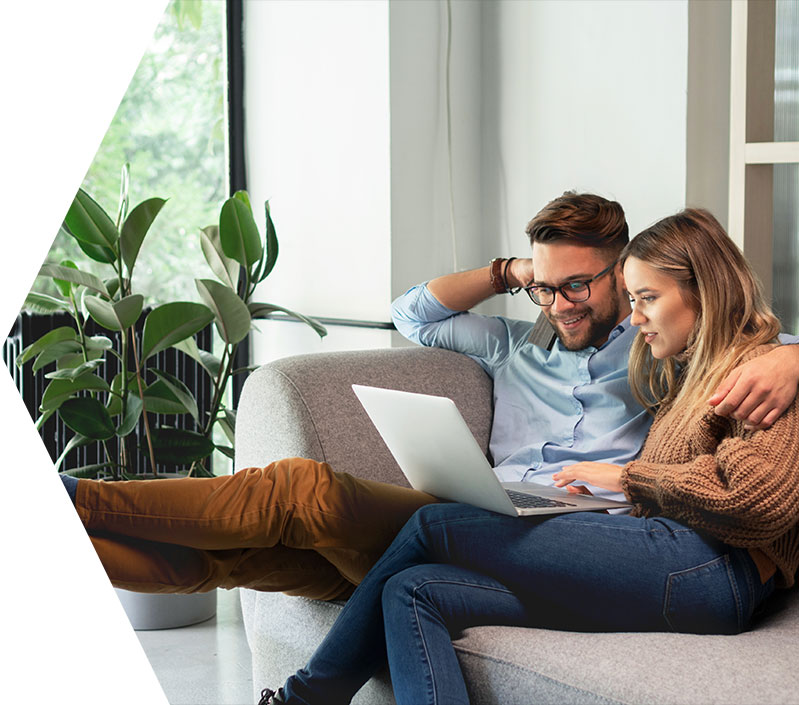 Couple viewing finances on laptop