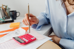 woman reviewing finances looking worried
